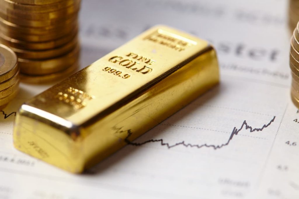 Gold bar on a gold trading sheet