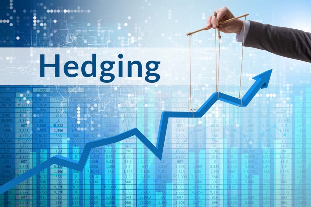 Hedging in trading shown by a trader using puppet strings