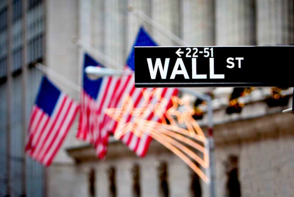 Wall Street building and road sign - The History of Wall Street