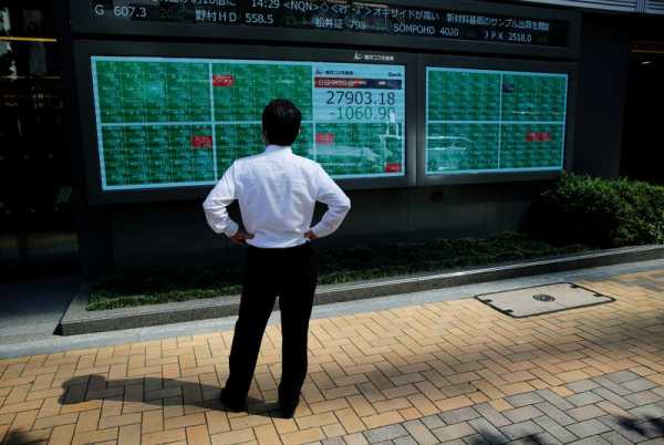 Asian stocks tumble, dollar gains after hawkish Powell comments