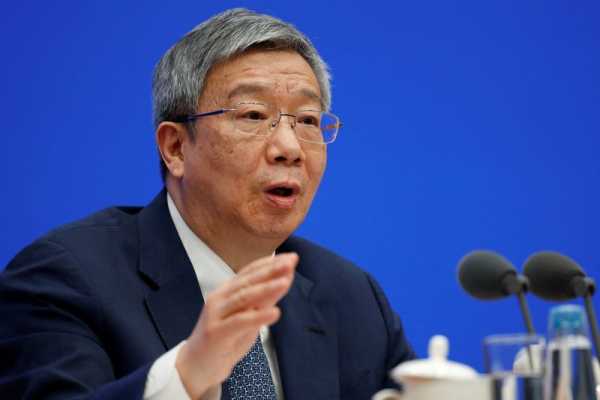 China unexpectedly retains central bank chief, finance minister